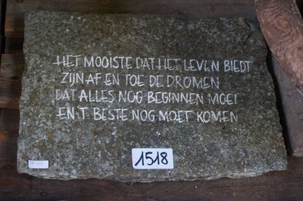 saying carved into natural stone - "THE MOST BEAUT