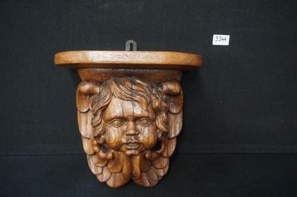 Antike Wandkonsole aus Holz – mit einem Cherub-Kop
