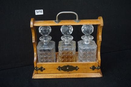 Antique English "THREE DECANTER TANTALUS"—with 3 c
