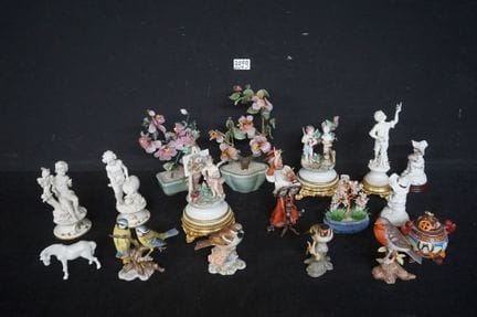 Assorted figurines and decorative items—most in bi