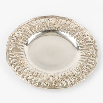 A silver plate, with ram's heads and garlands, Lou