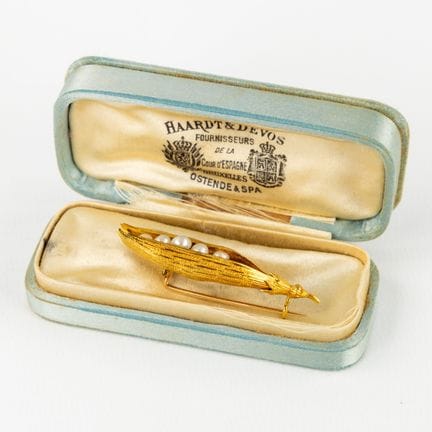 An antique brooch in the shape of a pod of peas. 1