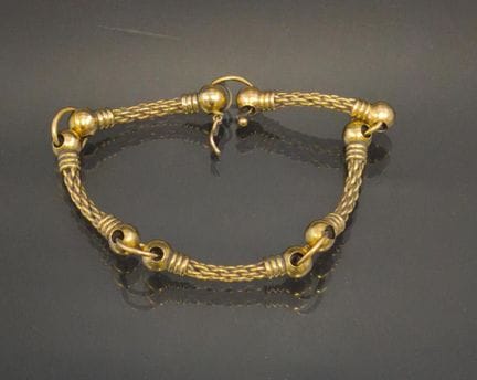 Bracelet articulé en or jaune 750 millième à motif