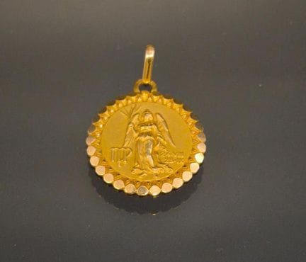 Médaille en or jaune 750 millième à décor du signe