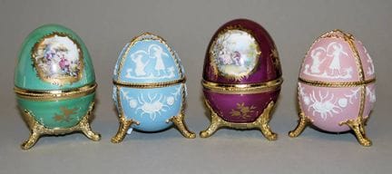 Four porcelain eggs with music boxes, in the tradi
