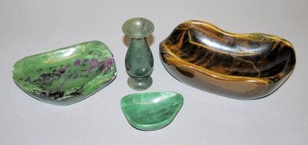 Three elegant bowls and a small vase made from gem