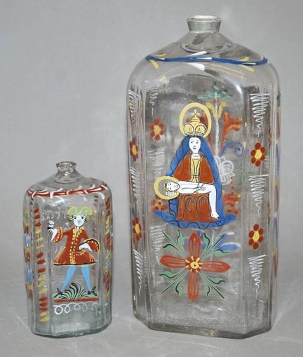 Two Alpine schnapps bottles, one of which is a wed