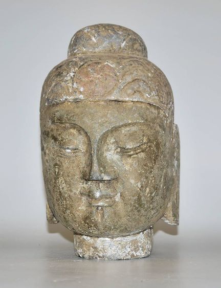 Tête de Bouddha chinoise en calcaire
Tête de style