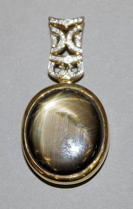 Heavy pendant with black star sapphires, brilliant