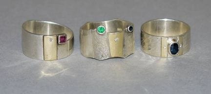 Three designer rings, gold/silver
14ct gold/925 si