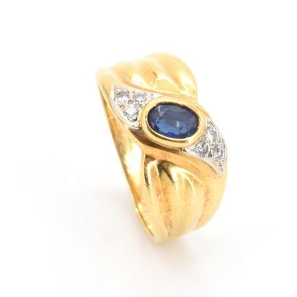 Anillo de oro amarillo y blanco de 18 quilates con