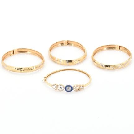 4 pulseras rígidas de oro amarillo y blanco de 14 