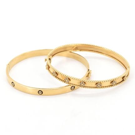 2 pulseras rígidas de oro amarillo y blanco de 18 