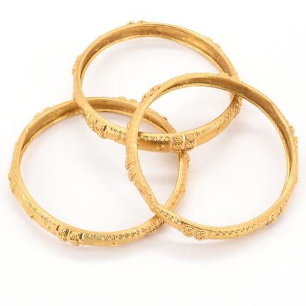 3 pulseras rígidas de oro amarillo de 18 quilates 