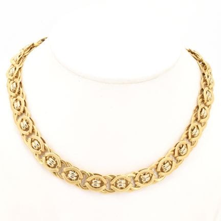 Collier en or jaune et blanc 18 ct (bosselé) - 35.