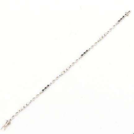 Bracelet en or blanc 18 ct serti de 9 brillants +/