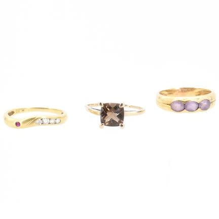 3 bagues en or jaune et blanc 18 ct (pierres fauss