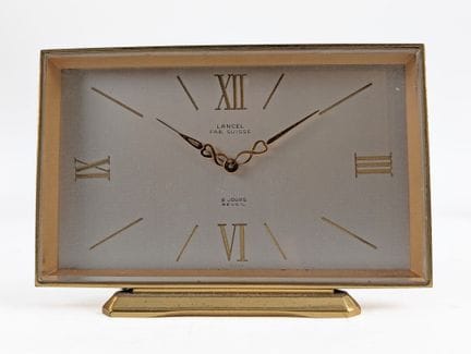 LANCEL 
Réveil à monture en laiton
On y joint un r