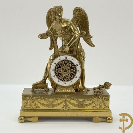 Fire-gilded French Empire-style bronze pendulum cl