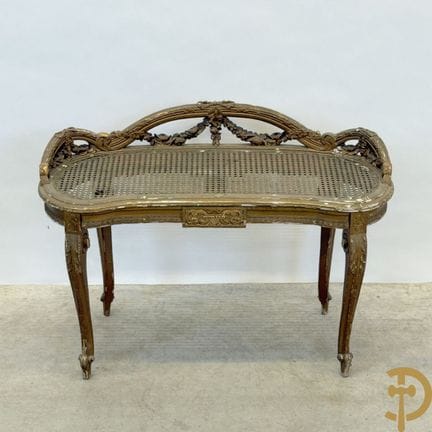 Gilded Louis XVI banquette with floral garlands an