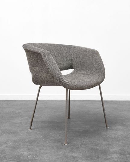 LOW WRAP-AROUND ARMCHAIR, CIRCA 1960–1970
Metal ba