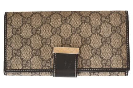 GUCCI 长款复古钱包
GG帆布材质，配以镀金五金件和皮革镶边。尺寸：17×10×2 厘米。