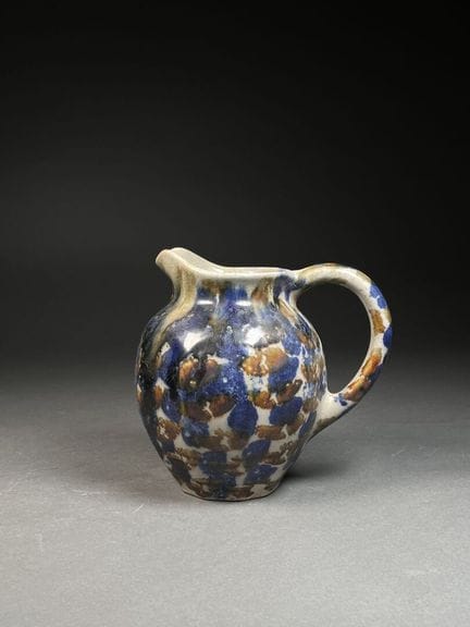 PITCHER decorated with multicolored spots 
Stonewa