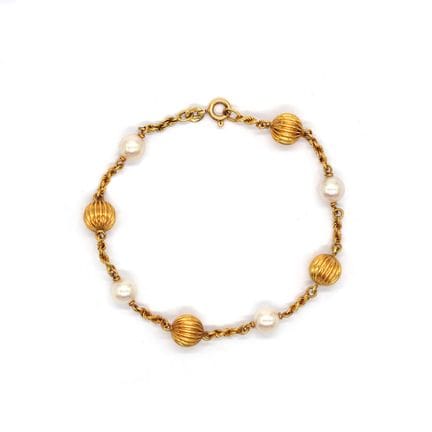 BRACELET composé de sphères texturées en or jaune 