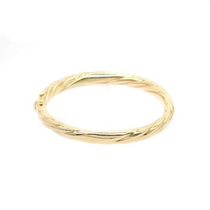 BRACELET jonc en or jaune 18K à décor torsadé. Ita