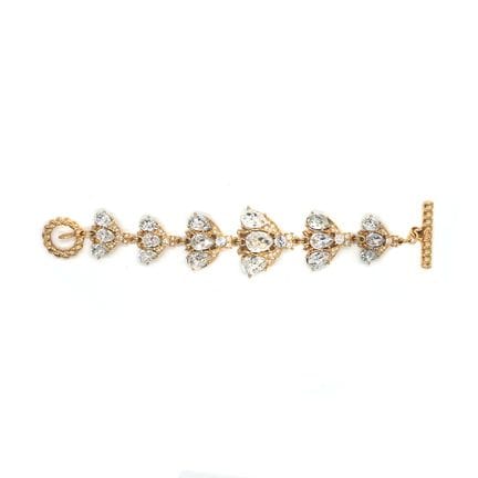 CHRISTIAN DIOR. Bracelet "Abeilles" en métal doré 
