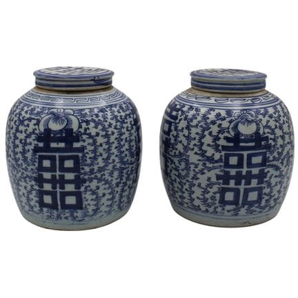Pair of antique porcelain vases with lids, featuri