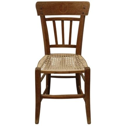 Wooden chair with an engraved fasces. Wood and str