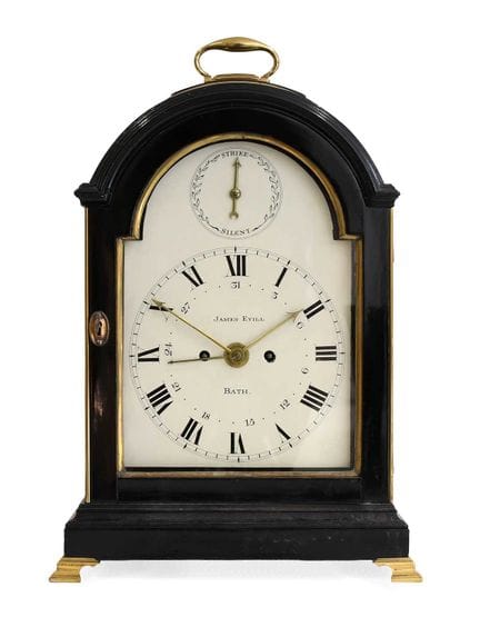 An Ebonised Striking Calendar Table Clock, signed 