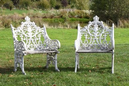 A Pair of Cast Metal and White Painted Bartholomew