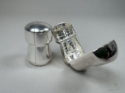 OVAL.
Two 925/1000 silver champagne cork cases.
We