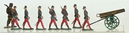 Set of 7 lead soldiers (6 cm) on parade, in crimso
