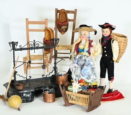 Set includes:
 - two regional dolls.
 - two chairs