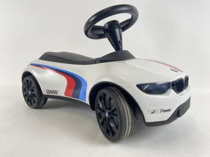 BMW.
Plastic toy car.
Lights controlled by a push 