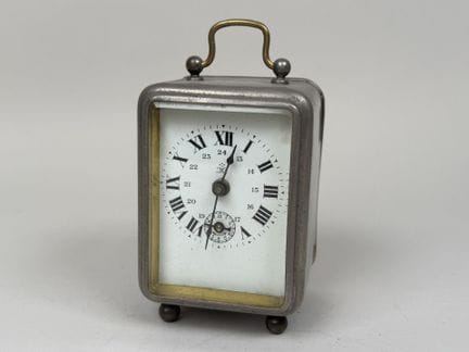 "THE WINNER".
Metal travel alarm clock with bevele