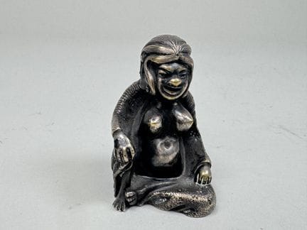 Small "erotic" female figure in silver-plated bron