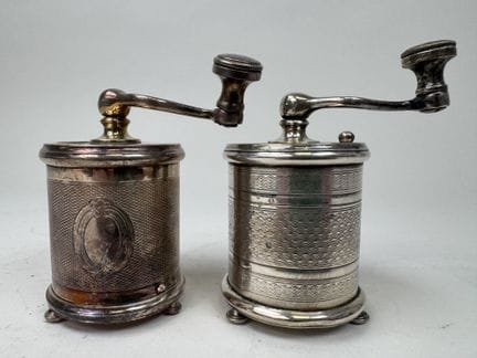 2 small silver plated metal pepper mills with guil
