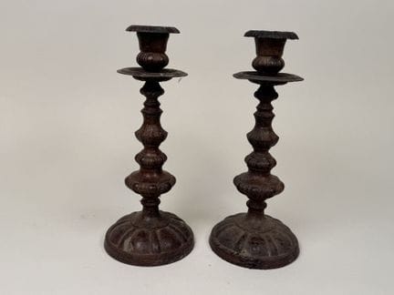 Pair of metal candlesticks with fluted decoration.