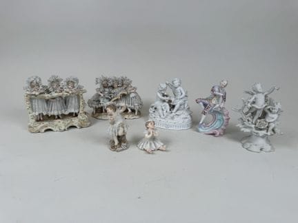 7 biscuit-ware pieces or sets, some polychrome wit