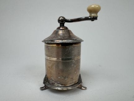TOURON.
Small silver plated pepper mill with a gui