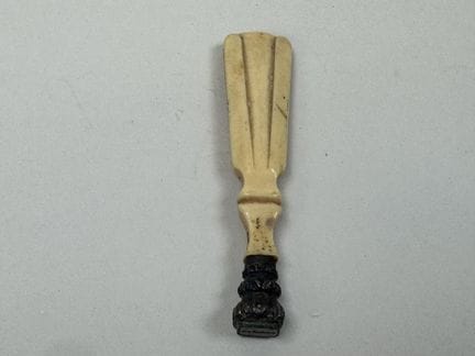 A seal made of synthetic ivory; the die is likely 