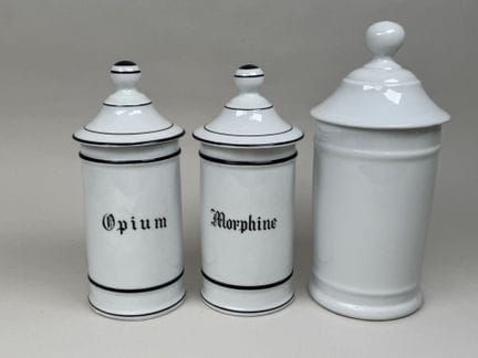 LIMOGES.
Three white porcelain medicine jars, incl