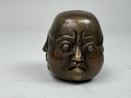 Chinese Janus-style magot head, made of bronze.
H: