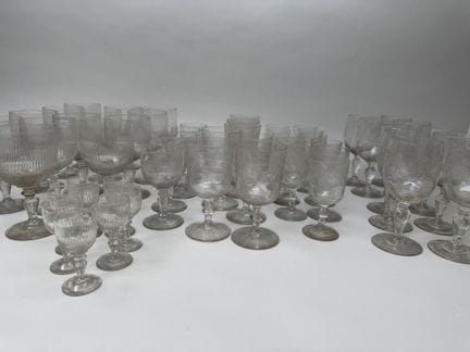 Various pieces from a set of engraved glassware, i