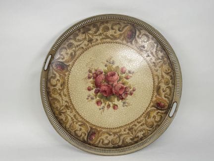 Large circular sheet metal tray with a polychrome 