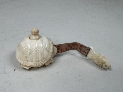 Small measuring tape made of synthetic ivory, deco